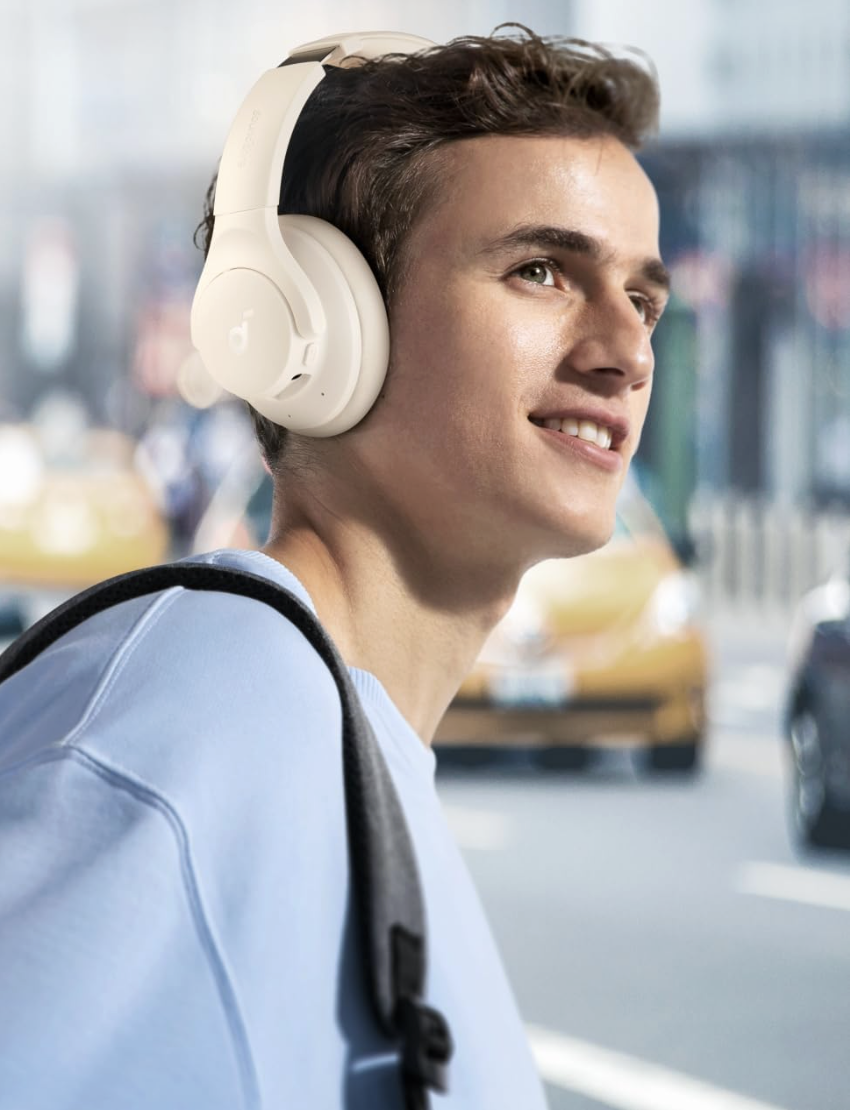 someone wearing the Soundcore by Anker Q20i Hybrid Active Noise Cancelling Headphones from Amazon 