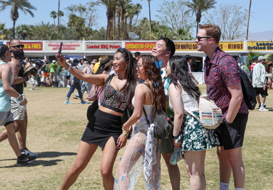 Festivalgoera take selfie at the Coachella Valley Music and Arts Festival at the Empire Polo Club in Indio, Calif., Friday, April 21, 2023. 