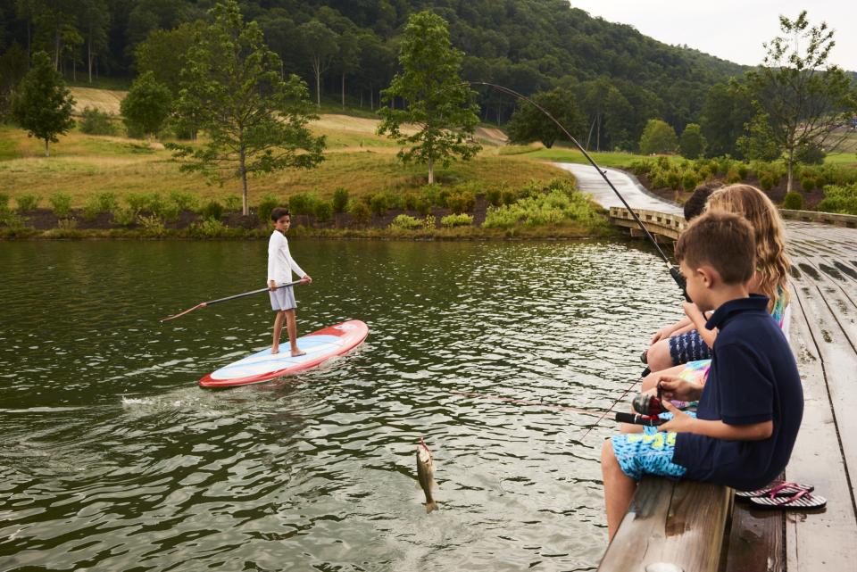 Children fish and paddleboard on one of Silo’s on-site ponds.