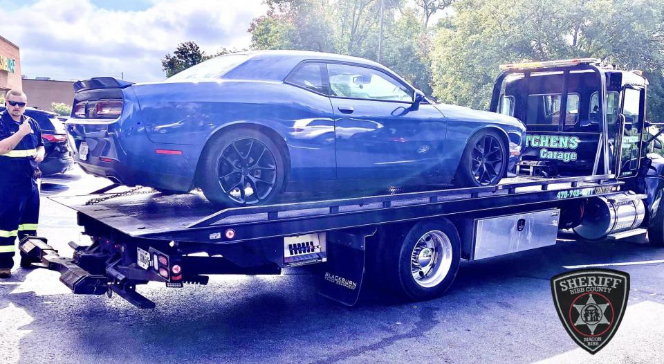 A blue Dodge Challenger was found abandoned in a parking lot in Macon, Georgia the day following the jail escape. / Credit: Bibb County Sheriff's Office / Facebook