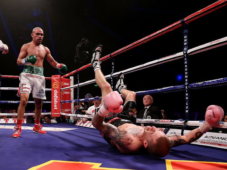 Raymundo Beltran knocks down Ricky Burns in their 2013 world title fightGetty