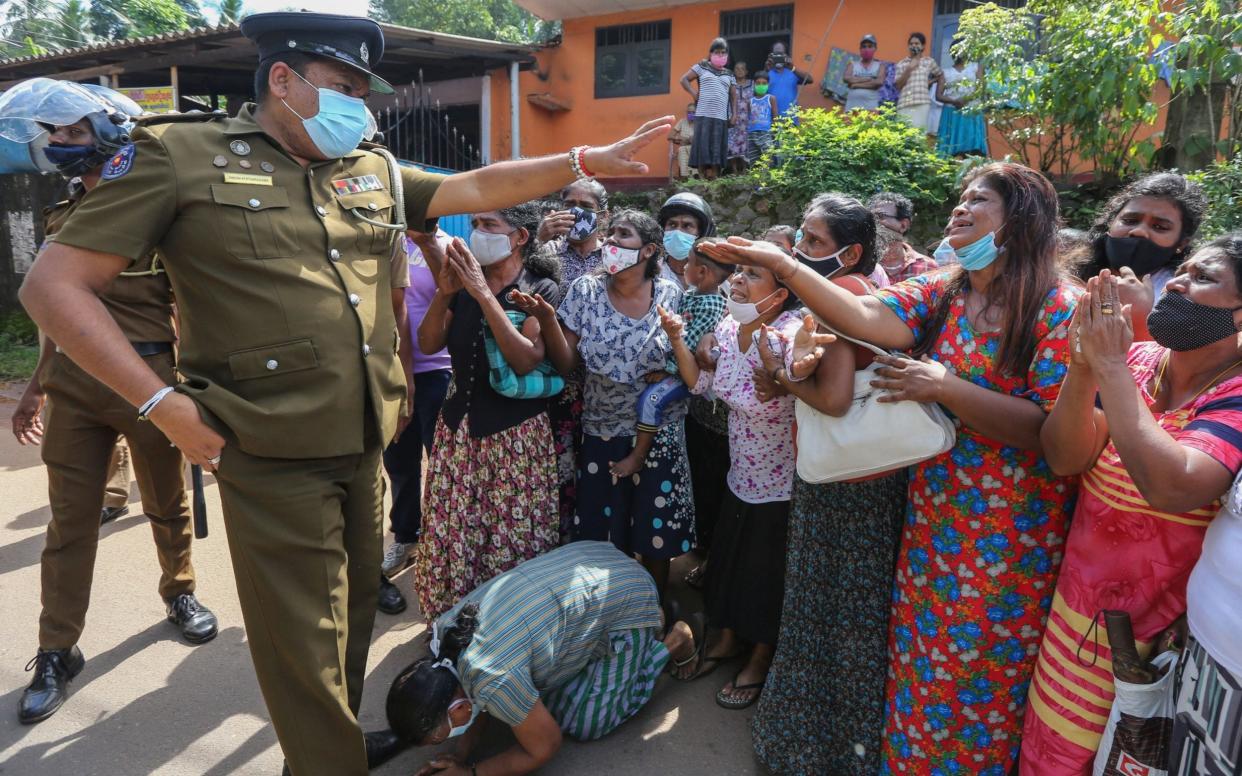 Relatives of the inmates of Mahara prison plead with security officials amid widespread rioting - Shutterstock