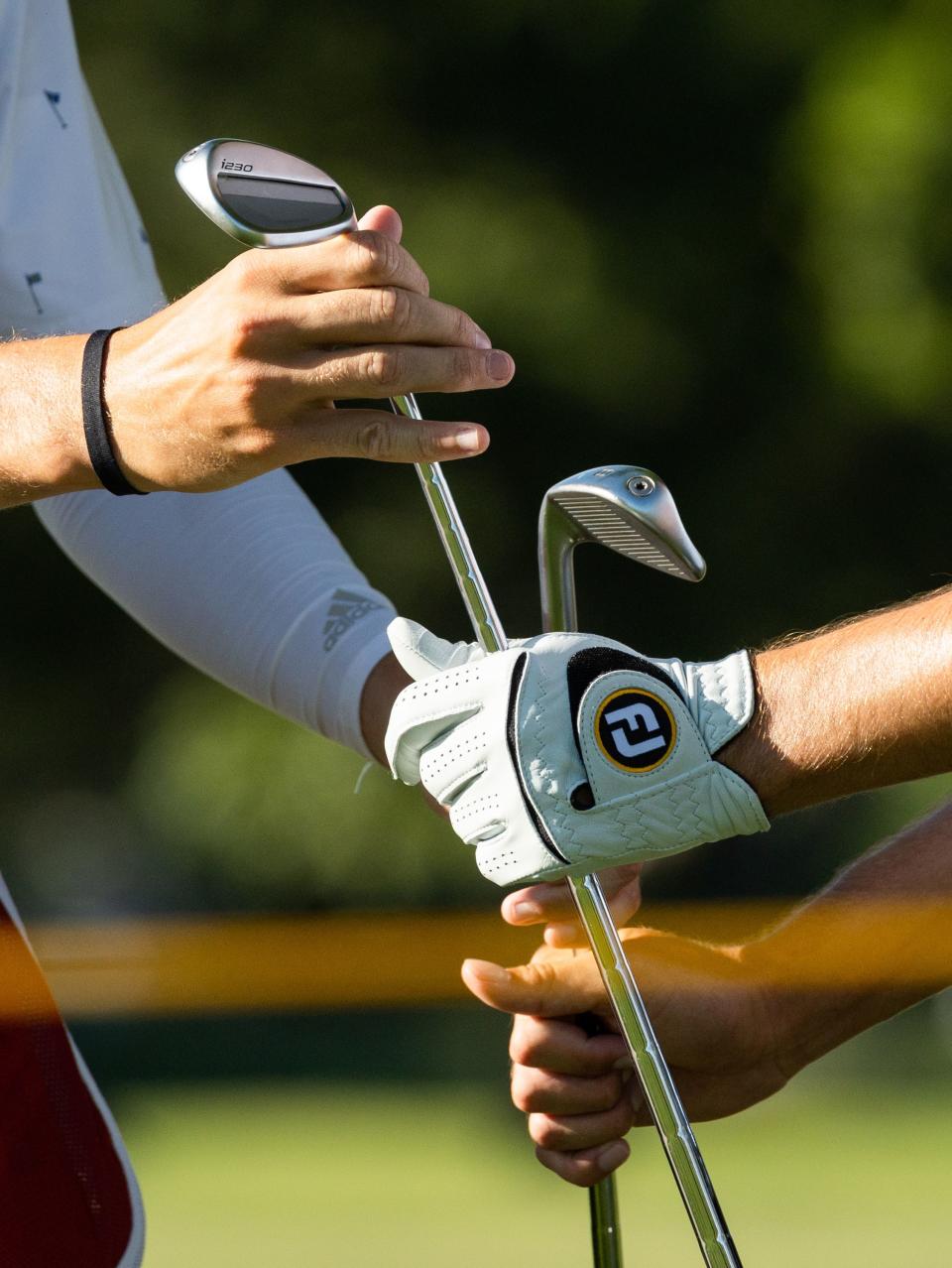 Christopher Petefish gets a club from his caddie on the 18th hole during the Utah Championship, part of the PGA Korn Ferry Tour, at Oakridge Country Club in Farmington on Sunday, Aug. 6, 2023. Petefish finished second place with -23. | MEGAN NIELSEN, Megan Nielsen, Deseret News