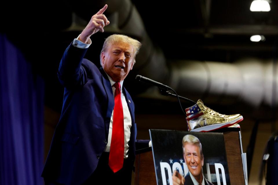 PHOTO: Republican presidential candidate and former President Donald Trump takes the stage to introduce a new line of signature shoes at Sneaker Con at the Philadelphia Convention Center, Feb. 17, 2024, in Philadelphia. (Chip Somodevilla/Getty Images)