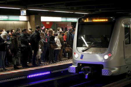 People wait as a subway train arrives at the Central Station stop in Brussels, Belgium, November 25, 2015. REUTERS/Benoit Tessier