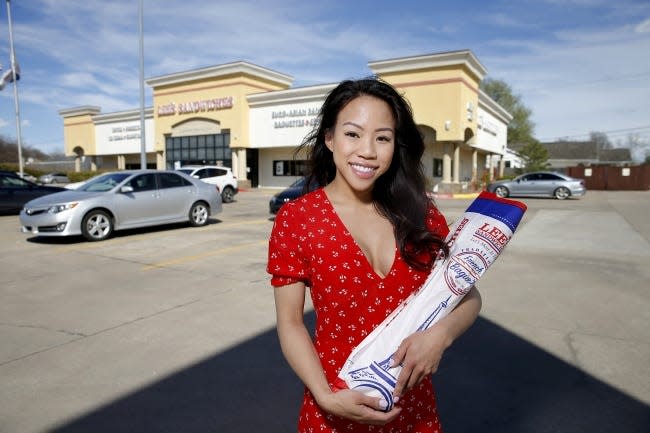 Jenny Nguyen stands March 19 in front of Lee's Sandwiches in Oklahoma City.
