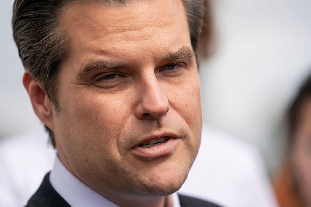 Gaetz's face is seen in close-up-.