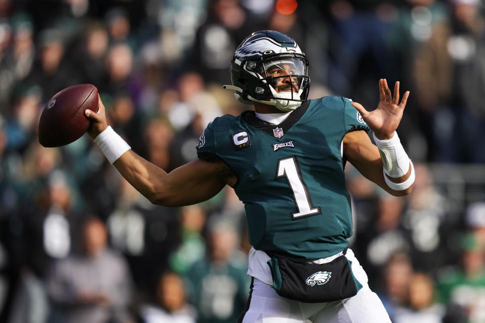 Philadelphia Eagles' Jalen Hurts looks to pass during the first half of an NFL football game against the Tennessee Titans, Sunday, Dec. 4, 2022, in Philadelphia. (AP Photo/Matt Slocum)