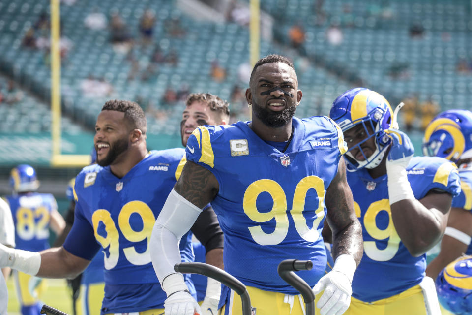 Los Angeles Rams defensive end Aaron Donald (99) defensive end Michael Brockers (90) and nose tackle Sebastian Joseph-Day (69) prepare for an NFL game against the Miami Dolphins, Sunday, Nov. 1, 2020 in Miami Gardens, Fla. The Dolphins defeated the Rams 28-17. (Margaret Bowles via AP)