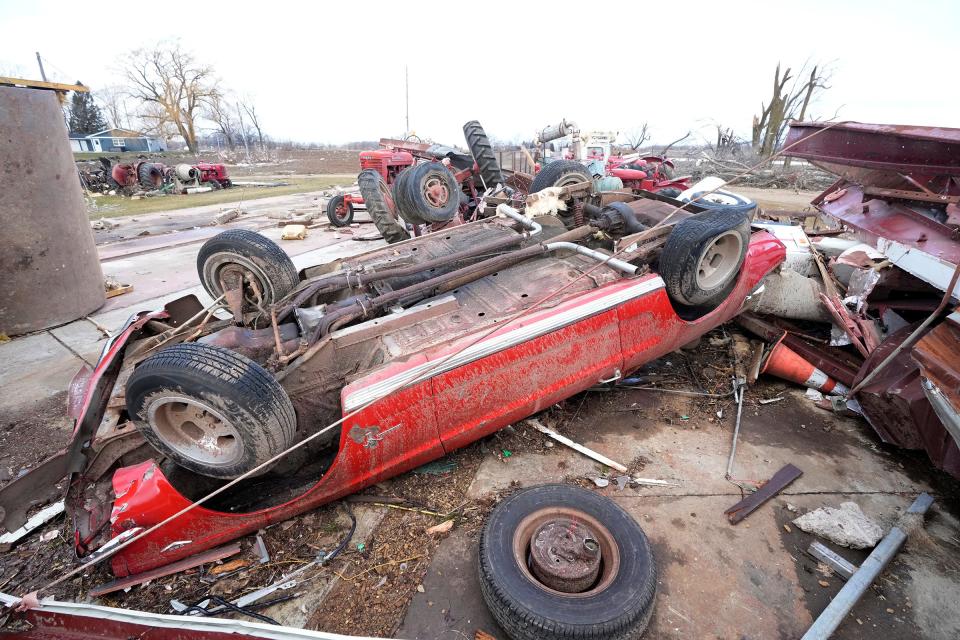 A Mustang is flipped over at residence as well as the site of a business, RK Construction, on North Tolles Road, just north of Highway 14 in Evansville after a tornado and severe storm hit the area Thursday night, according to Rock County authorities. - Mike De Sisti / Milwaukee Journal Sentinel