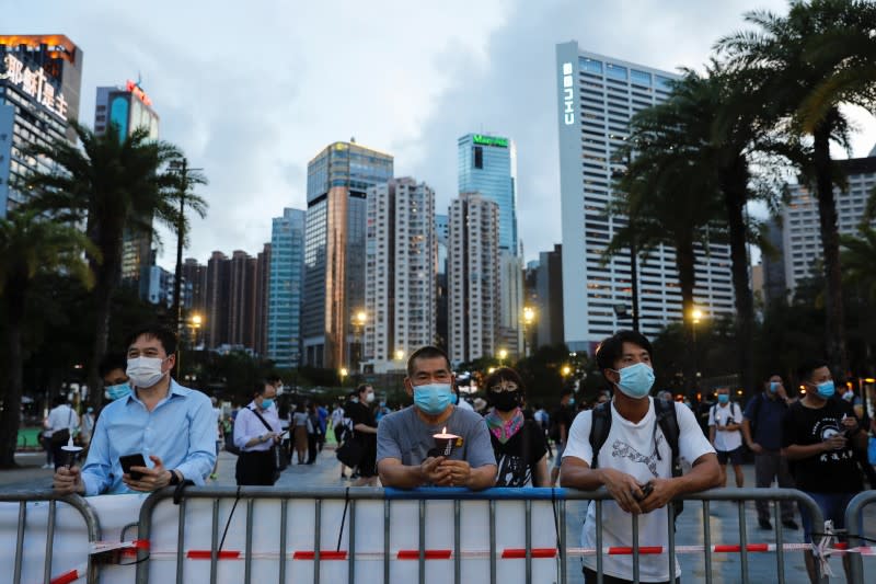 Protesters take part in a candlelight vigil to mark the 31st anniversary of the crackdown of pro-democracy protests at Beijing's Tiananmen Square in 1989, in Hong Kong