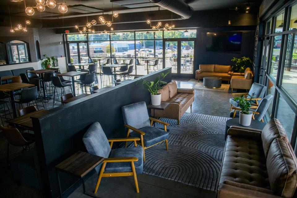 Customers can relax in a lounge area next to the main dining area at the new Peoria Heights tavern Clink Bar and Events in Heritage Square.