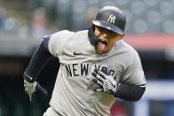 New York Yankees' Rougned Odor looks at his team's dugout as he runs the bases after hitting a solo home run in the fifth inning of a baseball game against the Cleveland Indians, Saturday, April 24, 2021, in Cleveland. (AP Photo/Tony Dejak)