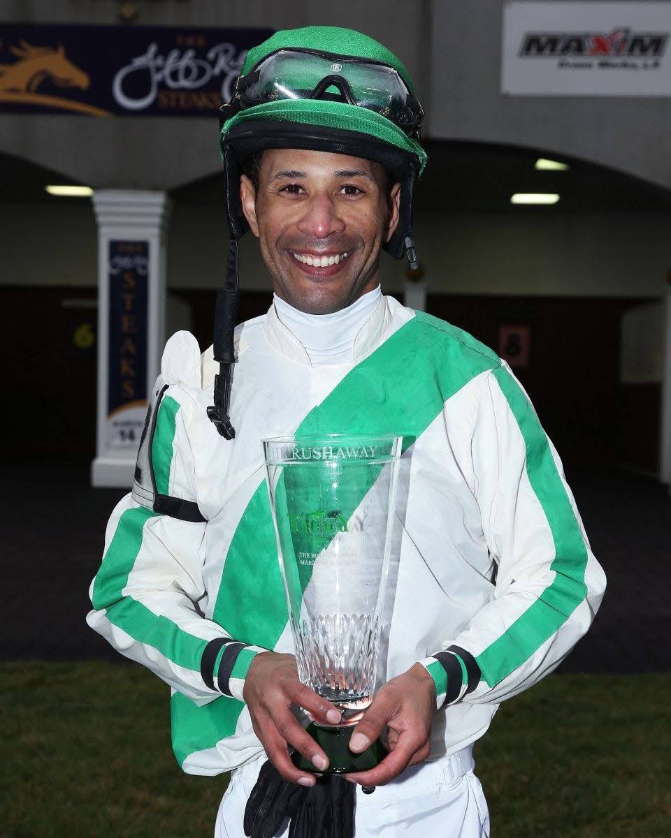 Jockey Kendrick Carmouche was presented a trophy after winning the Rushaway Stakes aboard Vanzzy on March 14, 2020, at Turfway Park.