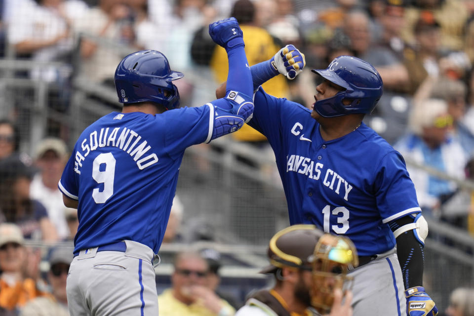 Kansas City Royals' Vinnie Pasquantino, left, celebrates with teammate Salvador Perez after hitting a two-run home run during the sixth inning of a baseball game against the San Diego Padres, Wednesday, May 17, 2023, in San Diego. (AP Photo/Gregory Bull)