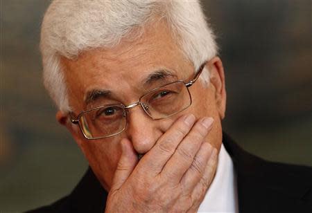 Palestinian President Mahmoud Abbas listens to a news conference during a state visit to Austria in Vienna, in this April 30, 2013 file picture. REUTERS/Heinz-Peter Bader/Files