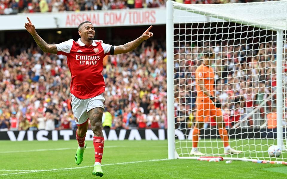 Arsenal's Brazilian forward Gabriel Jesus celebrates after scoring his team third goal during a club friendly football match between Arsenal and Sevilla - AFP