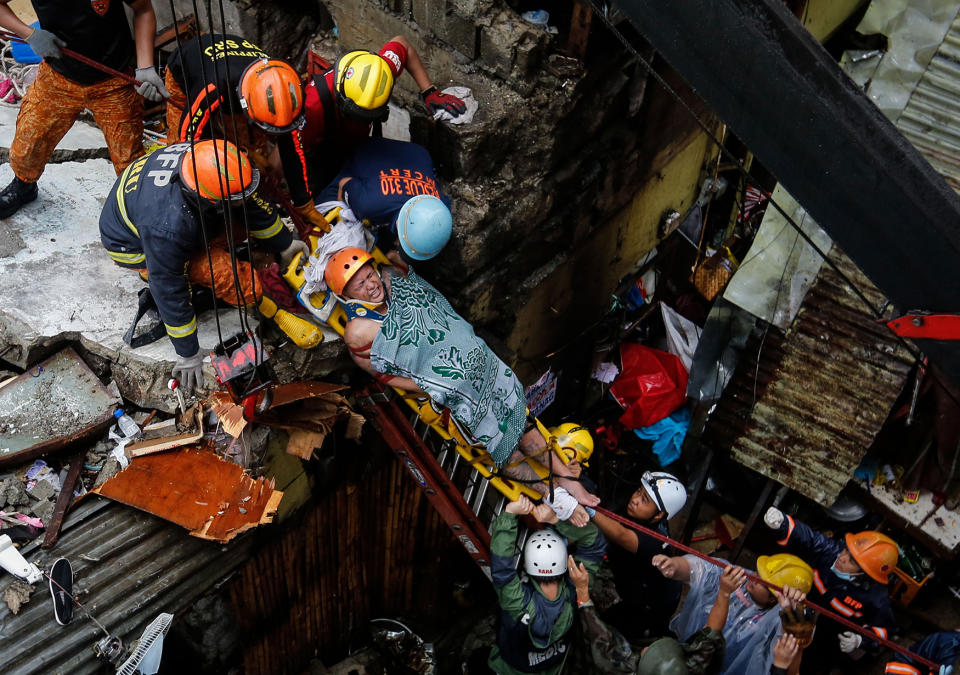 Concrete wall collapses in Manila damaging houses and killing two