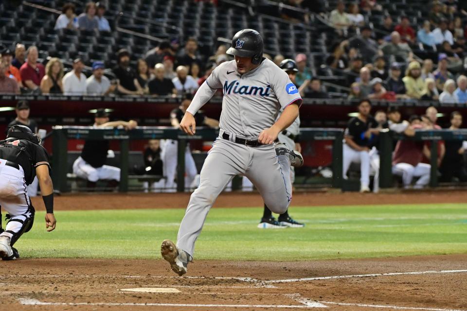 Miami Marlins catcher Nick Fortes (4) scores in the fifth inning against the Arizona Diamondbacks at Chase Field on May 8, 2023, in Phoenix.