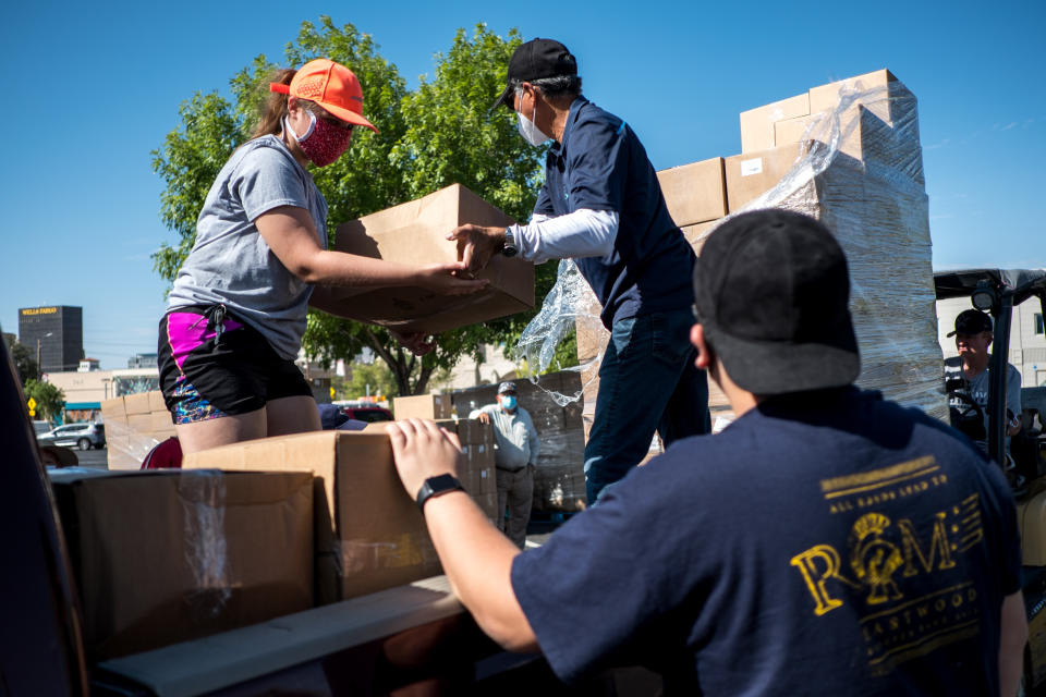 El Paso Baptist Association volunteers hand out boxes of food to church representatives in El Paso, Texas, U.S., on Friday, July, 17, 2020. (Photographer: Joel Angel Juarez/Bloomberg via Getty Images)