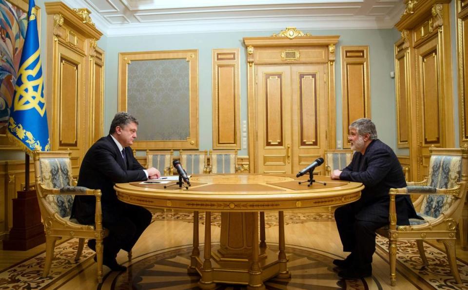 In this file photo taken on Wednesday, March 25, 2015, then-Ukrainian President Petro Poroshenko, left, listens to billionaire businessman Igor Kolomoisky in Kiev, Ukraine. Poroshenko sought to disparage then-candidate, now president, Volodymyr Zelensky as a ‘puppet’ of Kolomoisky.