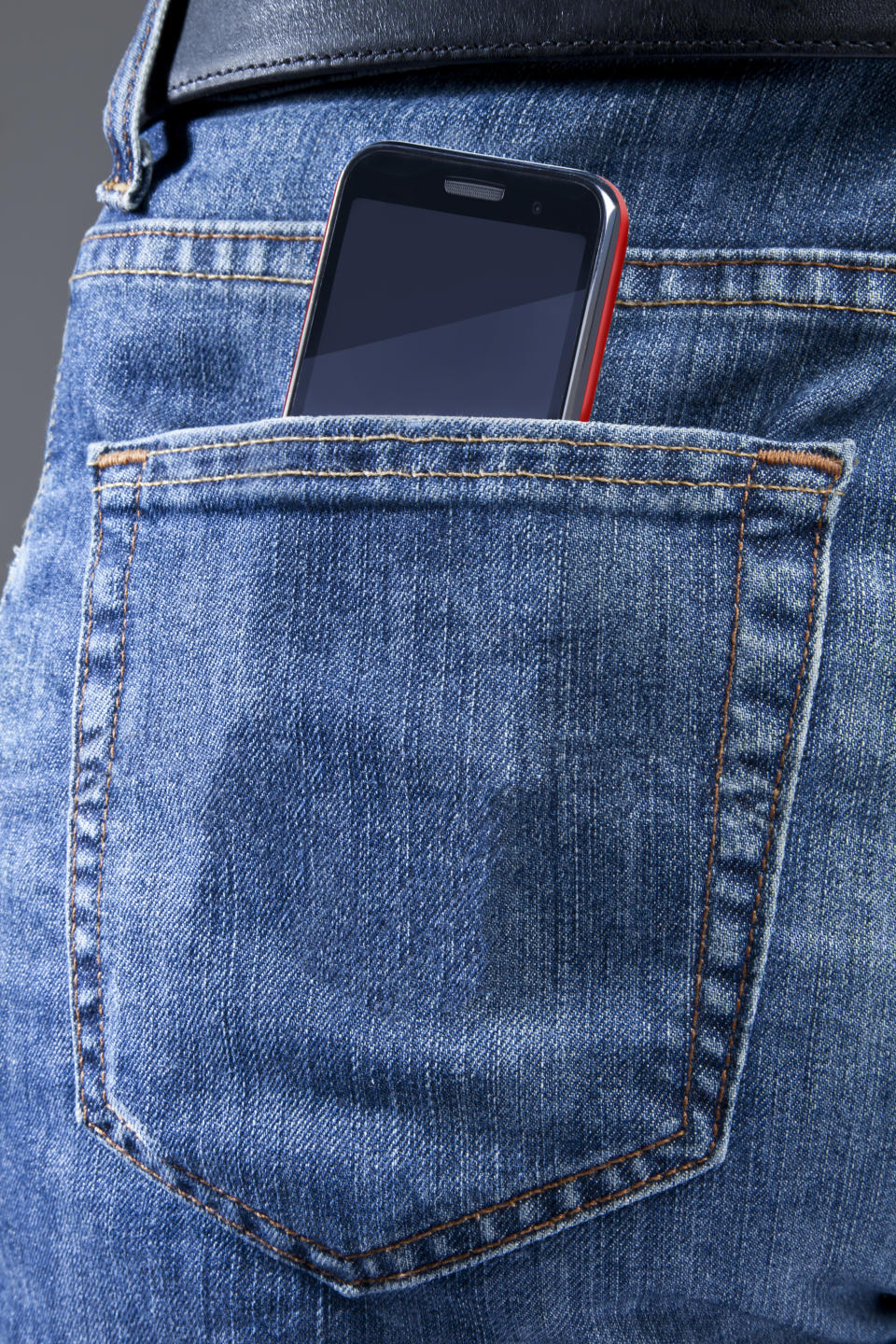 Smartphone in the blue jeans pocket.