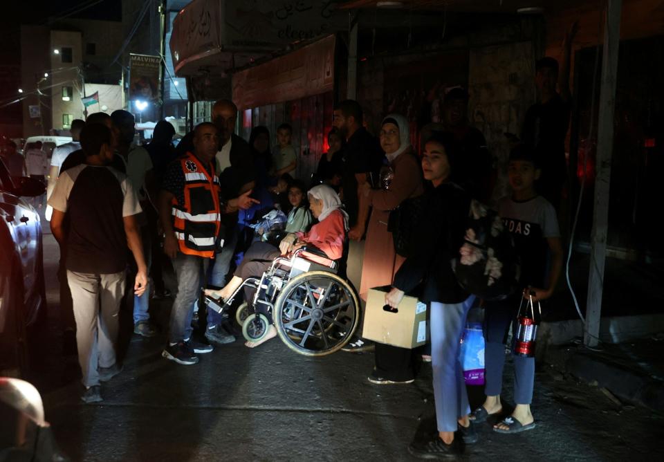 Residents evacuate the Jenin refugee camp during an Israeli military operation in the occupied West Bank (AFP via Getty Images)