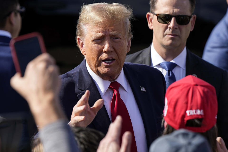 Republican presidential candidate former president Donald Trump speaks to supporters after arriving to Cerulean General Aviation, Tuesday, Feb. 20, 2024, in Greer, S.C. Trump will participate in a town hall event in Greenville, S.C. (AP Photo/Mike Stewart)
