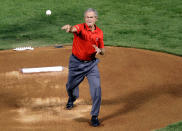 ARLINGTON, TX - OCTOBER 23: Former president George W. Bush throws out the ceremonial first pitch prior to Game Four of the MLB World Series between the St. Louis Cardinals and the Texas Rangers at Rangers Ballpark in Arlington on October 23, 2011 in Arlington, Texas. (Photo by Rob Carr/Getty Images)