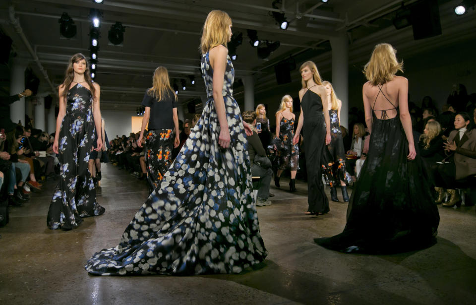 Models walk in the finale of the Peter Som Fall 2014 collection during Fashion Week in New York, Friday, Feb. 7, 2014. (AP Photo/Richard Drew)