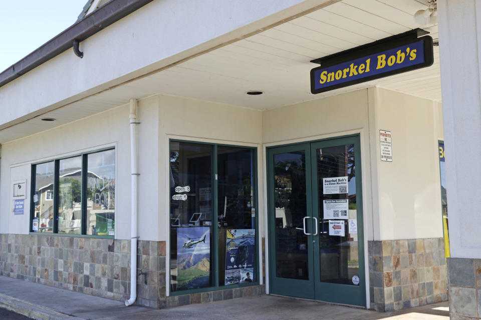 A dive shop that mostly caters to tourists remains closed several weeks after wildfires devastated the town of Lahaina, Friday, Sept. 1, 2023, in Kahana, Hawaii. So few tourists are coming to the Hawaiian island of Maui after last month's wildfires that restaurants and tour companies are laying off workers and unemployment is surging. State tourism officials initially urged travelers to stay away but now want them to come back so long as they refrain from going to the burn zone and surrounding area. (AP Photo/Marco Garcia)