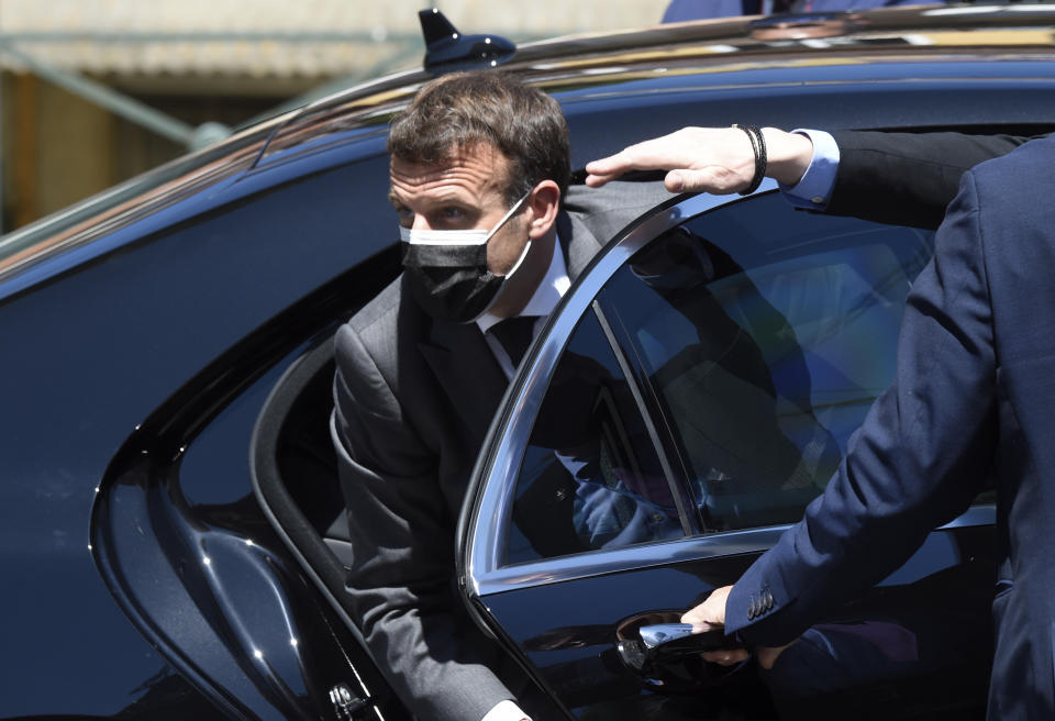 French President Emmanuel Macron arrives for an EU summit at the Alfandega do Porto Congress Center in Porto, Portugal, Friday, May 7, 2021. European Union leaders are meeting for a summit in Portugal on Friday, sending a signal they see the threat from COVID-19 on their continent as waning amid a quickening vaccine rollout. Their talks hope to repair some of the damage the coronavirus has caused in the bloc, in such areas as welfare and employment. (Miguel Riopa, Pool via AP)