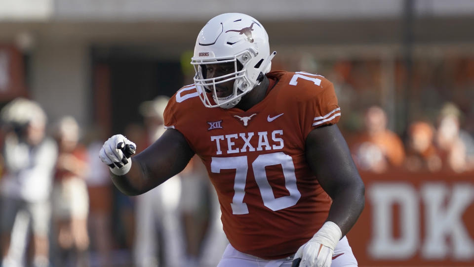 FILE - Texas' Christian Jones (70) blocks against Louisiana-Lafayette during the second half of an NCAA college football game on Saturday, Sept. 4, 2021, in Austin, Texas. Thanks to a bold new era of name, image and likeness deals across college sports, plenty of star players are cruising around campus in a fancy ride. But for every NIL millionaire there are thousands more athletes like Jones that might have made hundreds or thousands of dollars but who have hardly struck it rich. (AP Photo/Chuck Burton, File)