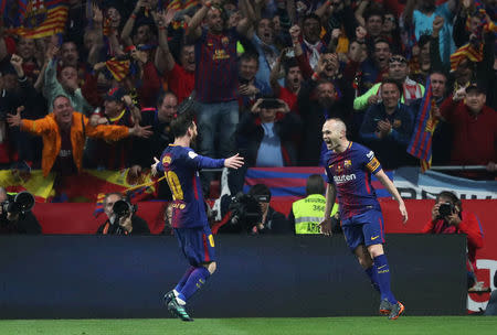 Soccer Football - Spanish King's Cup Final - FC Barcelona v Sevilla - Wanda Metropolitano, Madrid, Spain - April 21, 2018 Barcelona's Andres Iniesta celebrates scoring their fourth goal with Lionel Messi REUTERS/Susana Vera