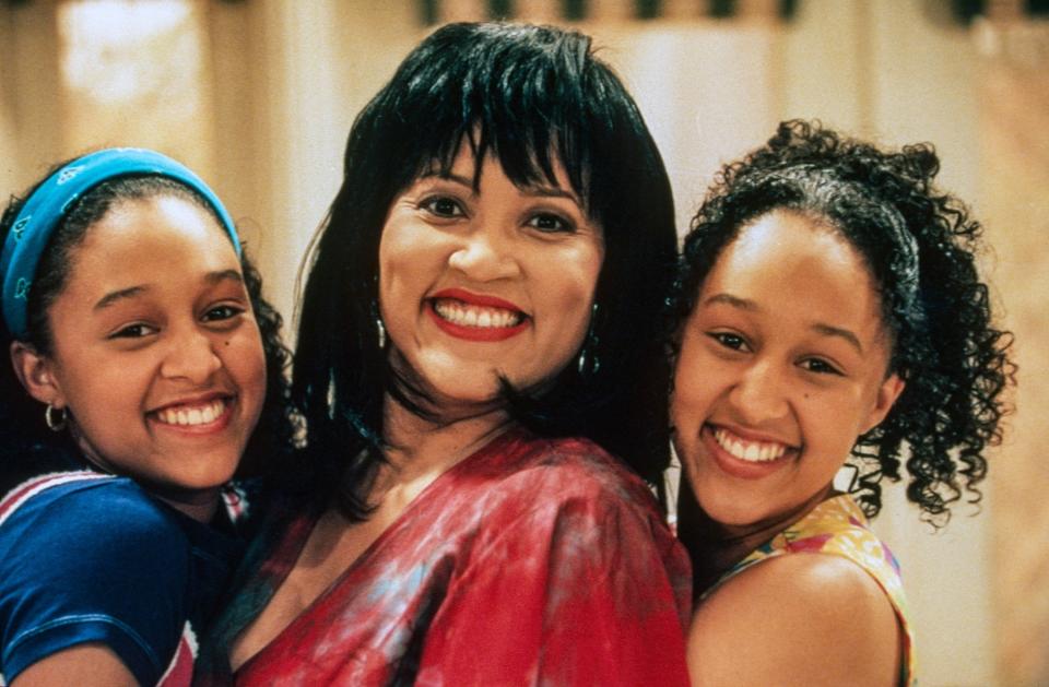 Tia and Tamera Mowry with Jackée Harry smiling together on set of "Sister, Sister"