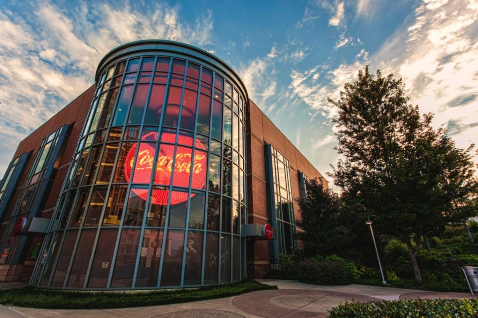 The illuminated Coca Cola sign in the World of Coca Cola entrance via Getty Images