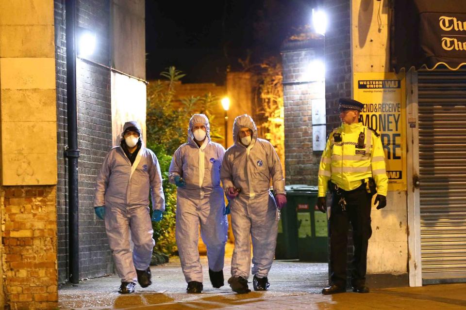 Police and forensic officers in Queensbury after a man was shot dead: NIGEL HOWARD ©