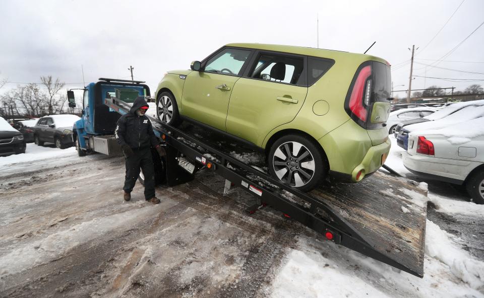 A Kia is offloaded from a tow truck and delivered to the Rochester Police Department impound lot on Colfax Street on Jan. 26, 2023. Kia and Hyundai cars are being stolen at an alarming rate.