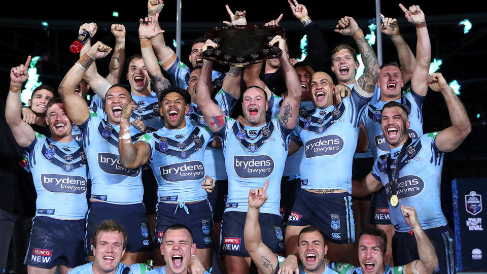 NSW celebrate with the State of Origin trophy after winning the decider. (Photo by Cameron Spencer/Getty Images)