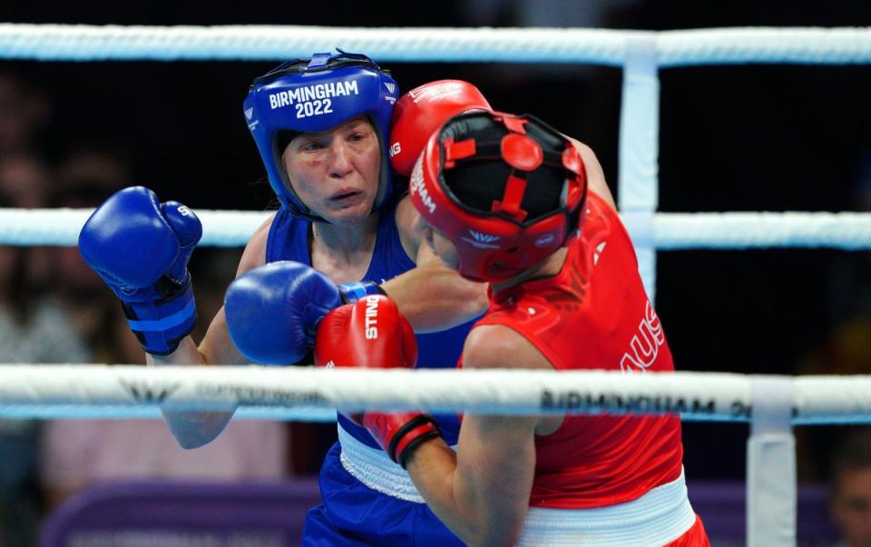 Rosie Eccles (blue) stopped Australia’s Kaye Scott to claim boxing gold (Peter Byrne/PA) (PA Wire)