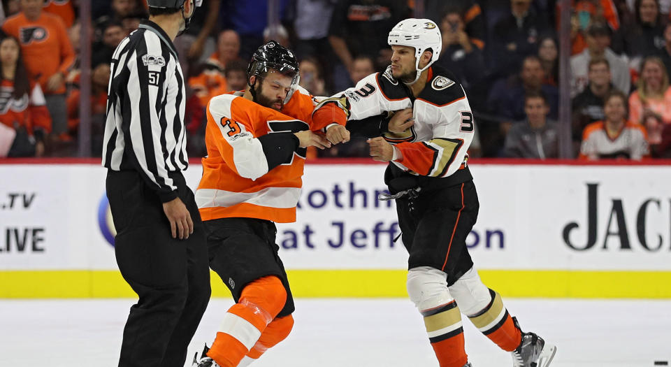 Kevin Bieksa of the Anaheim Ducks lands a huge punch on Radko Gudas of the Philadelphia Flyers. (Photo by Patrick Smith/Getty Images)