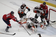 Washington Capitals' John Carlson (74) scores a goal against Anaheim Ducks goalie John Gibson (36) during the second period of an NHL hockey game, Monday, Dec. 6, 2021, in Washington. (AP Photo/Luis M. Alvarez)