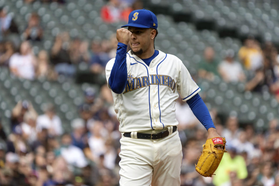 Seattle Mariners starting pitcher Luis Castillo pumps his fist while walking off the field during the second inning of a baseball game against the Seattle Mariners, Wednesday, Sept. 14, 2022, in Seattle. (AP Photo/Stephen Brashear)