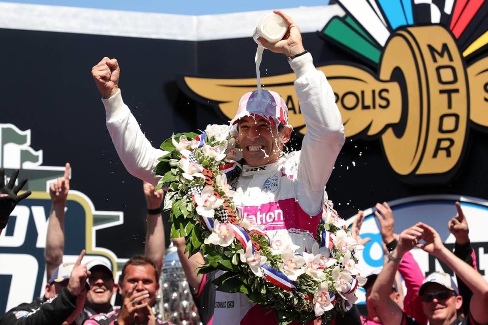 Fort Lauderdale resident Helio Castroneves, formerly of Brazil and Coral Gables, celebrates winning his fourth Indianapolis 500 in Victory Lane on May 30, 2021.