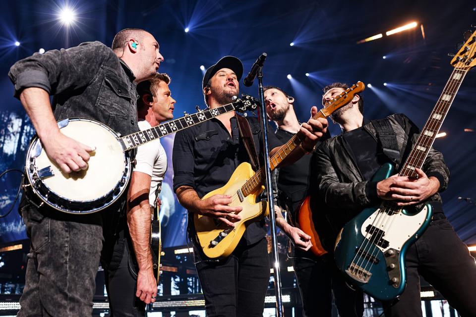 Luke Bryan (C) performs during the opening night of his residency at Resorts World Las Vegas on February 11, 2022 in Las Vegas, Nevada.