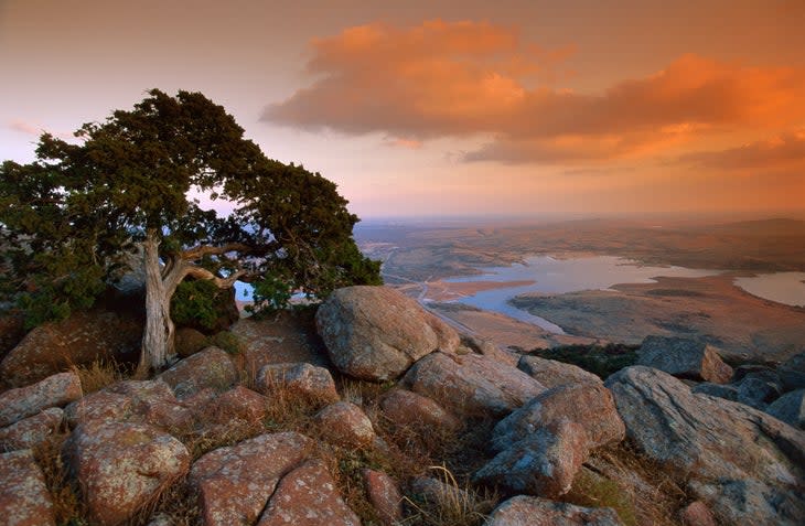 <span class="article__caption">The view from atop 2,464-foot Mt. Scott in the Wichita Mountains National Wildlife Refuge.</span> (Photo: John Elk / The Image Bank via Getty Images)