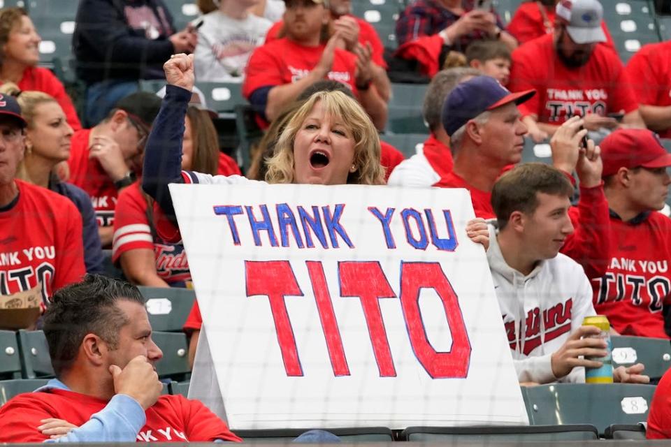 A fan holds a sign that reads "Thank You Tito," in tribute to Guardians manager Terry Francona before the team played the Cincinnati Reds, Wednesday, Sept. 27, 2023, in Cleveland.