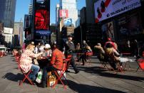 A New York Police Department (NYPD) officer patrols Times Square in New York on November 25, 2015