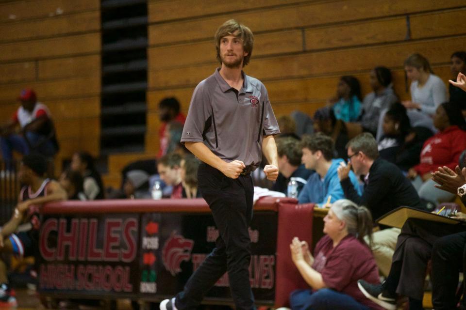 Chiles head coach Eli Phillips celebrates a play in a game between Leon and Chiles on Jan. 20, 2023, at Chiles High School. The Timberwolves won, 56-53.