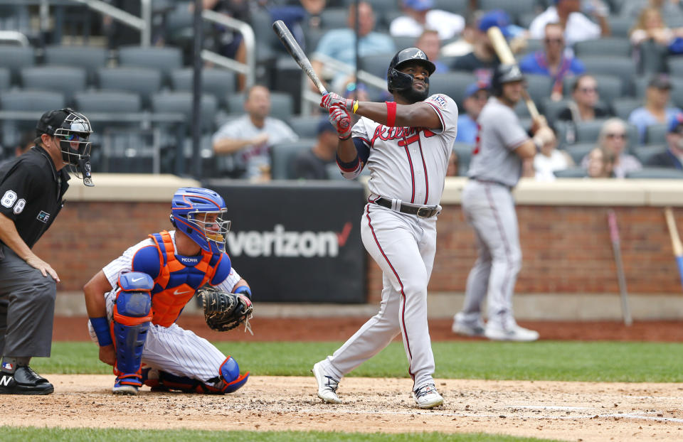 Atlanta Braves right fielder Abraham Almonte (34) follows through on a home run against the New York Mets during the fourth inning of a baseball game Thursday, July 29, 2021, in New York. (AP Photo/Noah K. Murray)